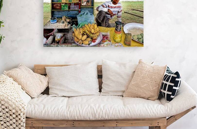 Street market scene in Yangon showing vendor and fresh fruits by Marco Brivio