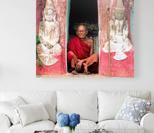 Old monk meditates in temple doorway in Myanmar by Marco Brivio