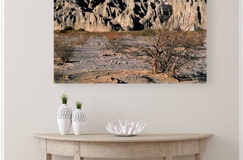 Rugged cliffs rise over dry desert in Calchaquí Valleys Argent by Marco Brivio