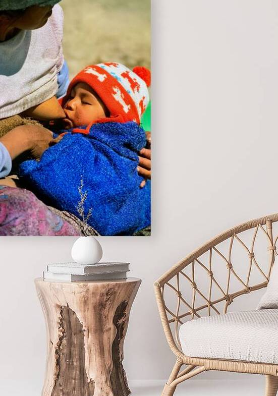 Indigenous mother nourishes child in the Andes of Argentina by Marco Brivio