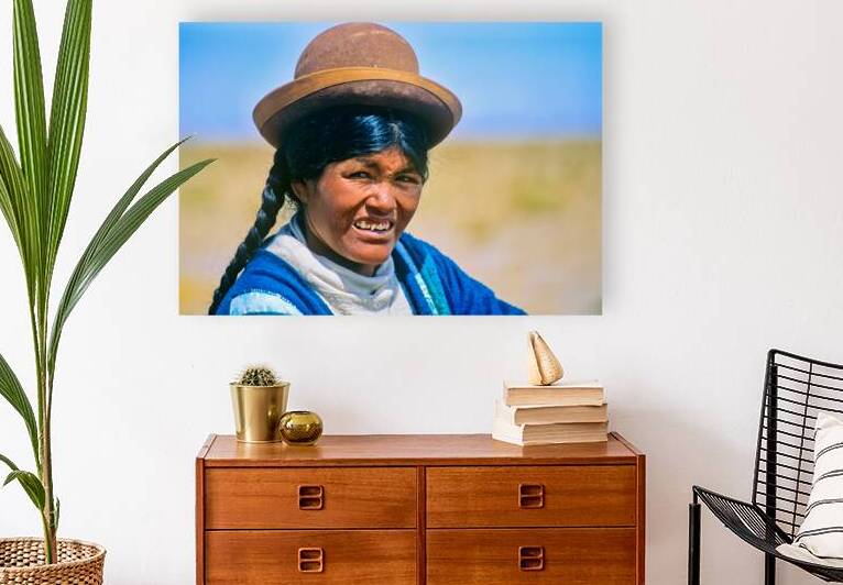 Smiling indigenous woman in hat and braid. by Marco Brivio