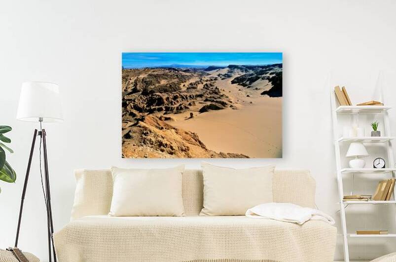 Vast desert valley sand dunes and sculpted rock formations. by Marco Brivio