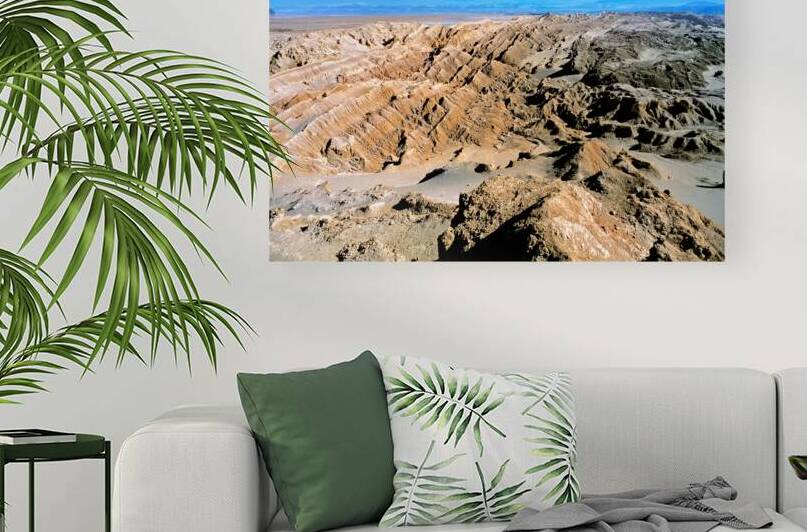 Dramatic desert landscape with eroded formations under a blue sk by Marco Brivio