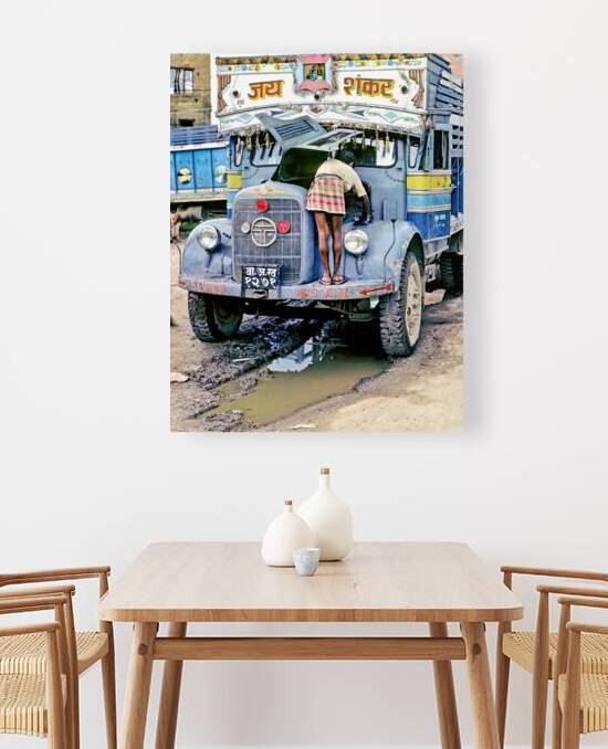 Repairing a truck in Kathmandu Nepal during the daytime by Marco Brivio