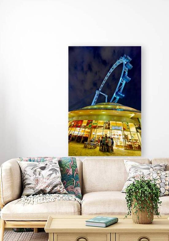 Visitors gather near Flyer in Singapore at night for city views by Marco Brivio