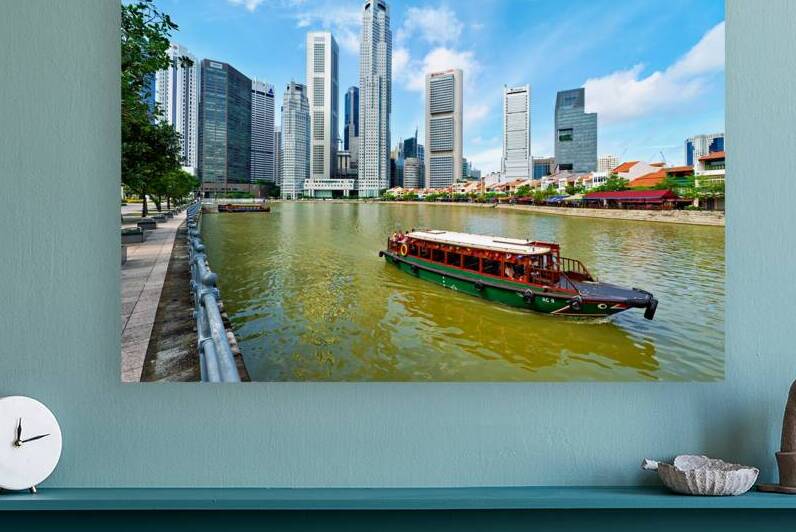 People enjoy boat trip on river in downtown Singapore by Marco Brivio