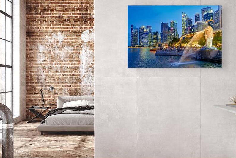 Visitors enjoy the Merlion fountain near Marina Bay Sands at dus by Marco Brivio