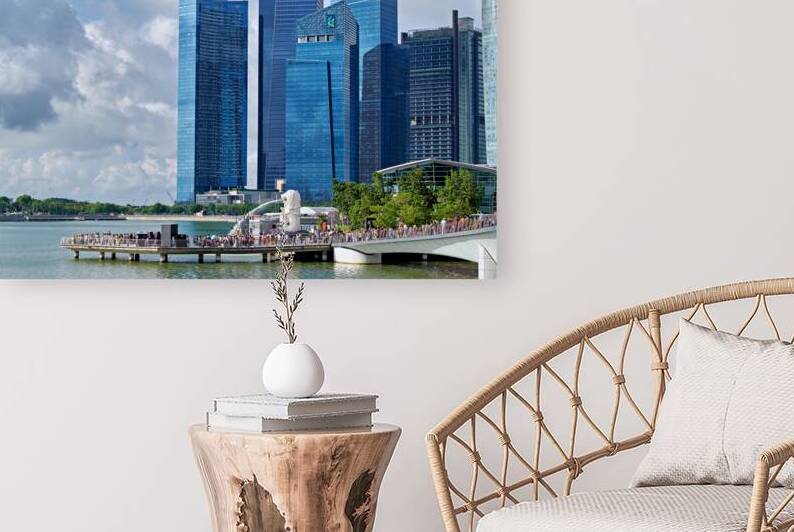 People are walking near a bridge in Singapores financial distri by Marco Brivio