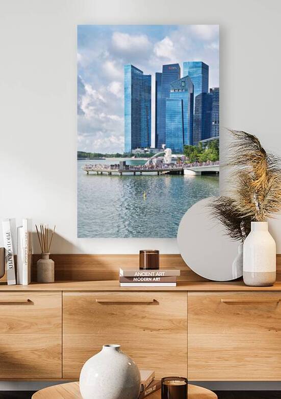 People walk near bridge in Singapore financial district with bui by Marco Brivio