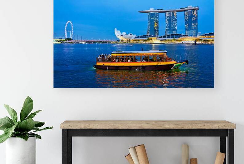 Sunset boat rides past Merlion and Marina Bay Sands by Marco Brivio
