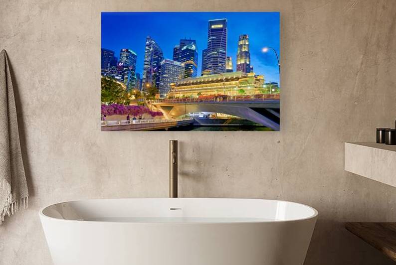 People walk by the waterfront in Marina Bay during sunset in Sin by Marco Brivio