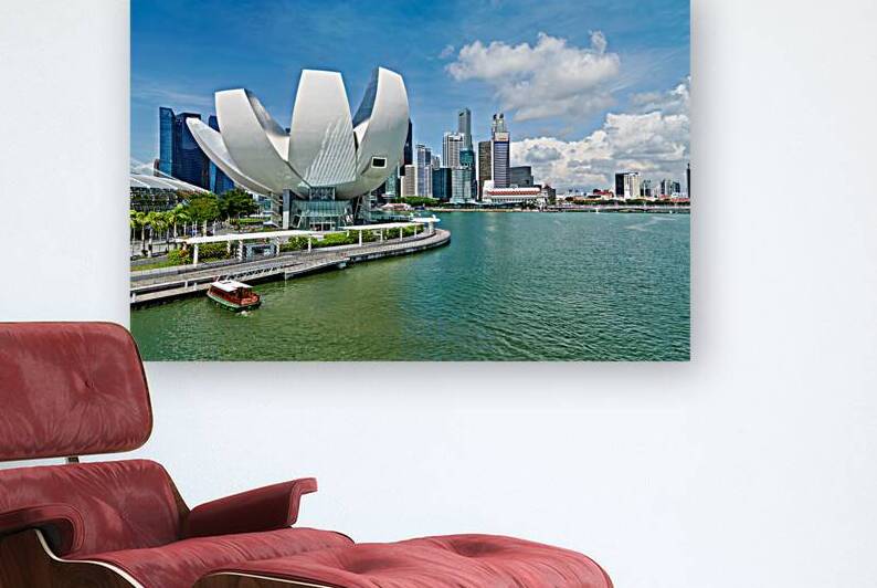 Visitors view ArtScience Museum and city skyline in Singapore by Marco Brivio