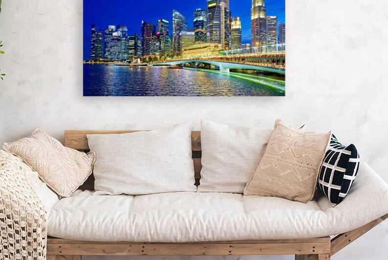 City skyline reflected on water at sunset in Marina Bay by Marco Brivio