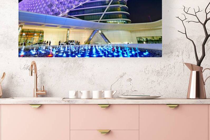 Visitors explore the W Abu Dhabi Yas Island hotel at night by Marco Brivio