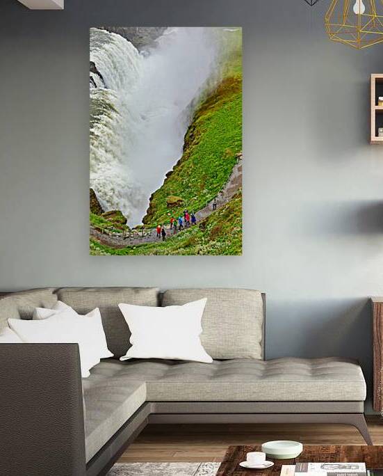 Visitors explore Gullfoss waterfall in Iceland on a cloudy day by Marco Brivio