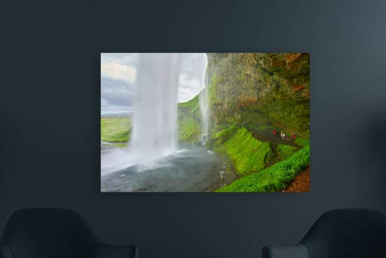 Seljalandsfoss waterfall view from behind in Iceland by Marco Brivio