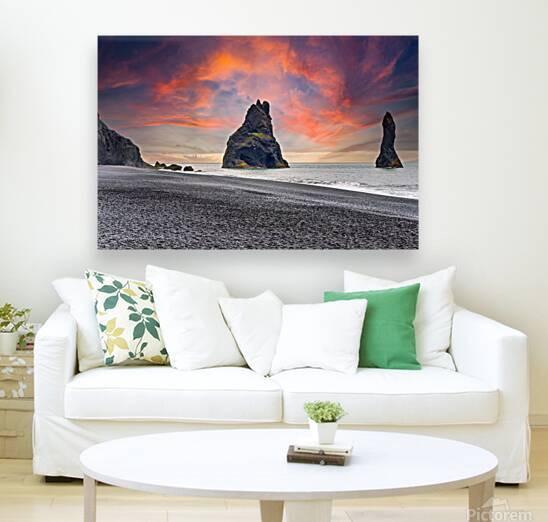 Reynisfjall coast in Iceland with dark sea stacks and black sand by Marco Brivio