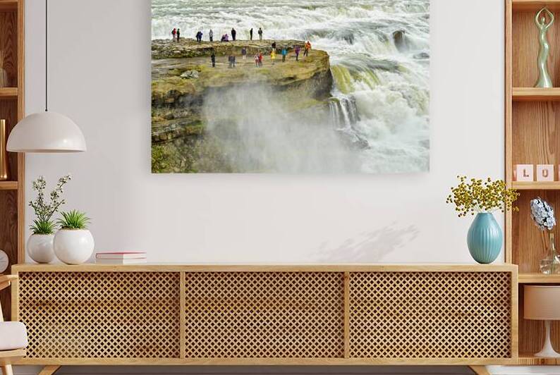 Visitors admire Gullfoss waterfall in Iceland on a cloudy day by Marco Brivio