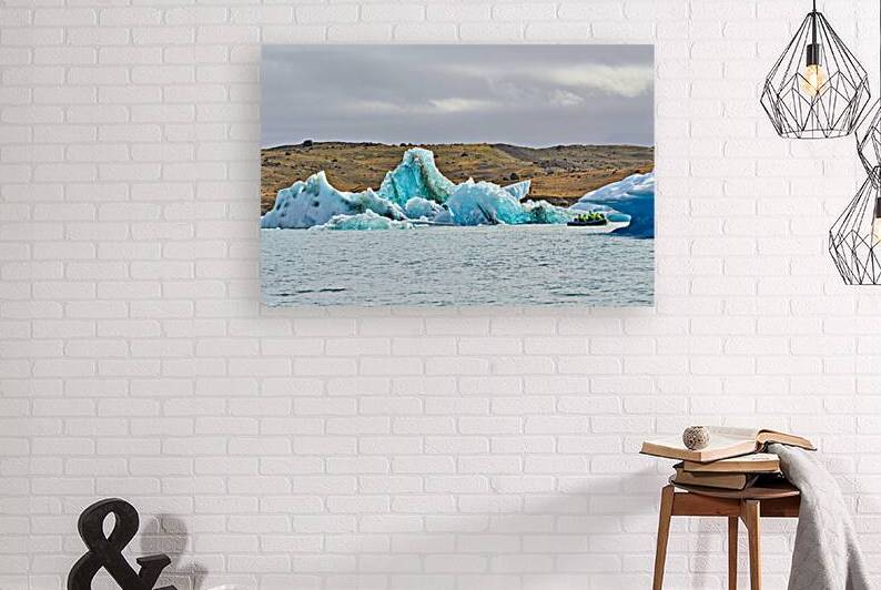 Tourists explore Jokulsarlon glacier lagoon in Iceland by Marco Brivio