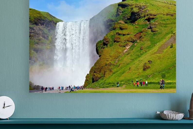 People visiting Skogafoss waterfall during daylight in Iceland by Marco Brivio