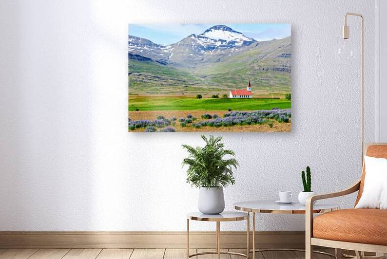 Heydalir Church in Iceland with mountains in the background by Marco Brivio
