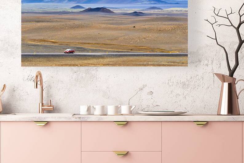 Car driving along Hringvegur road in Iceland landscape by Marco Brivio