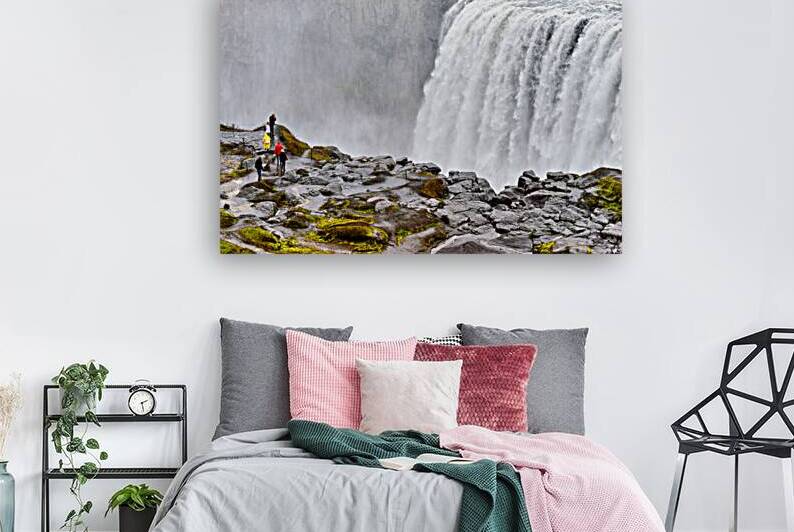 Visitors stand near Dettifoss waterfall in Iceland by Marco Brivio