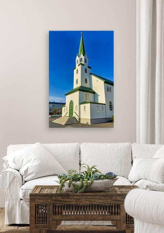 Lutheran Free Church in Reykjavik Iceland during daylight hours by Marco Brivio