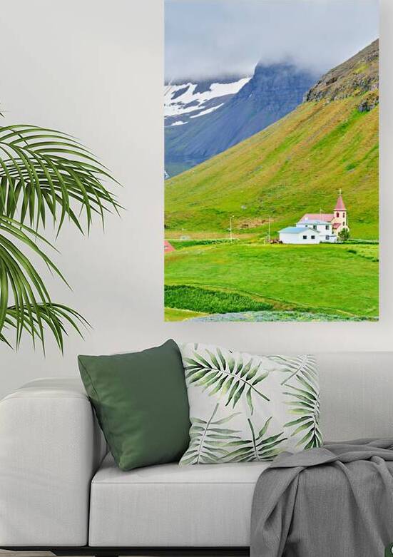 Bolungarvik church stands among green hills and mountains by Marco Brivio