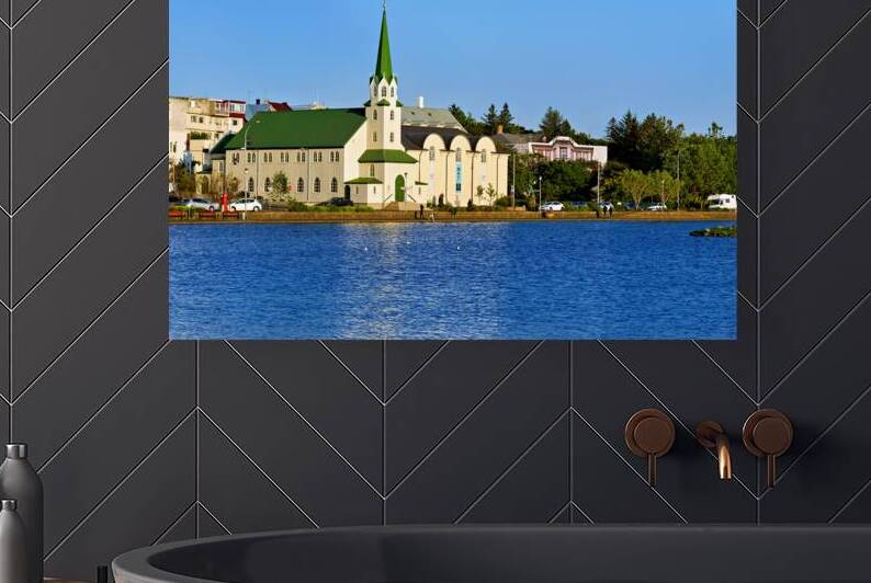 Lutheran Free Church near Lake Tjornin in Reykjavik Iceland by Marco Brivio