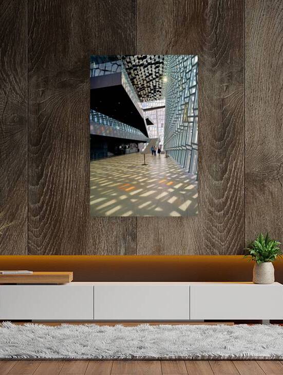 Visitors walk through Harpa Opera House in Reykjavik Iceland by Marco Brivio