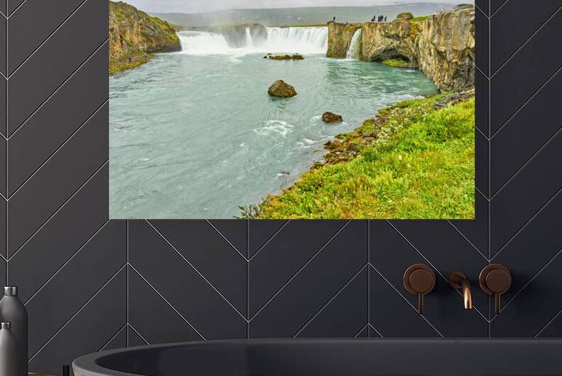 Exploring Godafoss waterfall in Iceland on a cloudy day by Marco Brivio