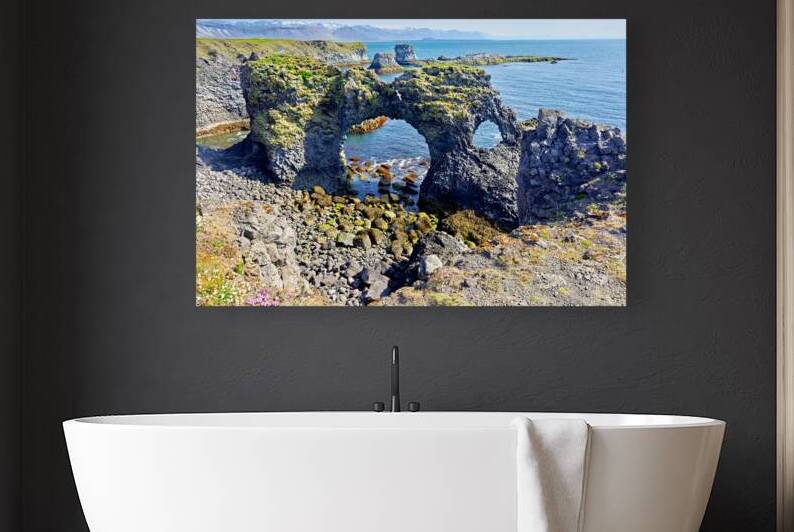 Exploring arnarstapi cliff in Iceland by the ocean by Marco Brivio