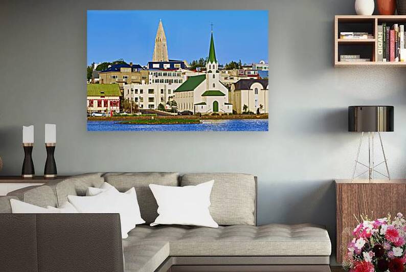 Lutheran free church and Halgrimskirkja near Tjornin lake by Marco Brivio