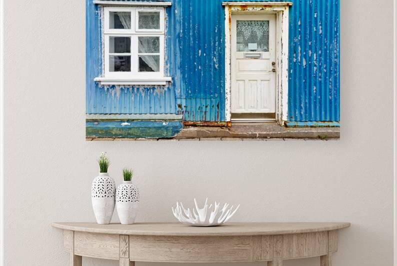 Old house exterior in Isafjordur Iceland with blue wall by Marco Brivio