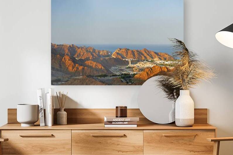 Aerial view of Muscat Oman showing mountains and sea by Marco Brivio