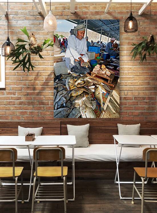 Fish sellers at Muscat Oman market display fresh catch by Marco Brivio