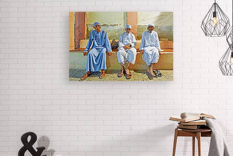 Men sitting together at Mutrah Souq in Muscat Oman by Marco Brivio