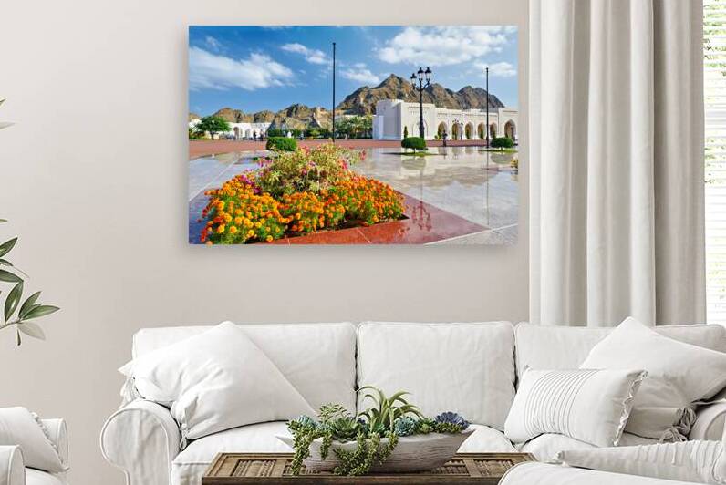 Visitors explore Al Alam Palace in Muscat Oman during the day by Marco Brivio