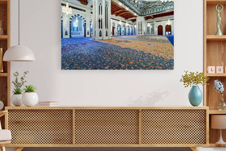 Visitors explore Sultan Qaboos Grand Mosque in Muscat Oman by Marco Brivio