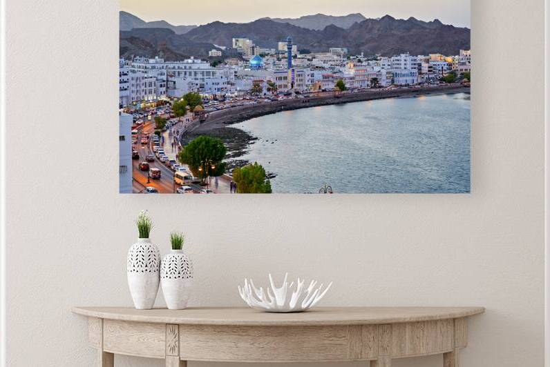Waterfront cityscape view of Muscat Oman at dusk by Marco Brivio