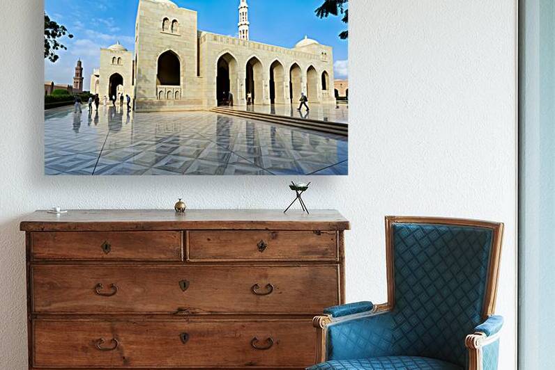 Visitors explore Sultan Qaboos Grand Mosque in Muscat Oman by Marco Brivio