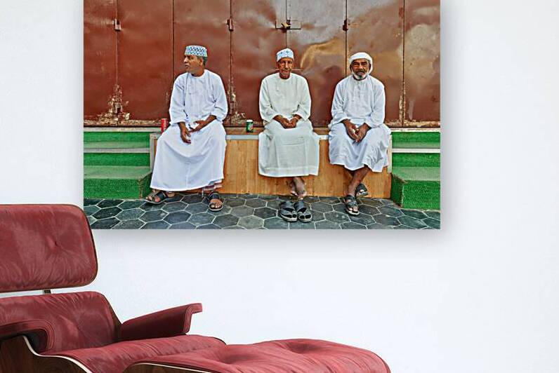 Local men relax on a bench in Muscat Oman during the afternoon by Marco Brivio