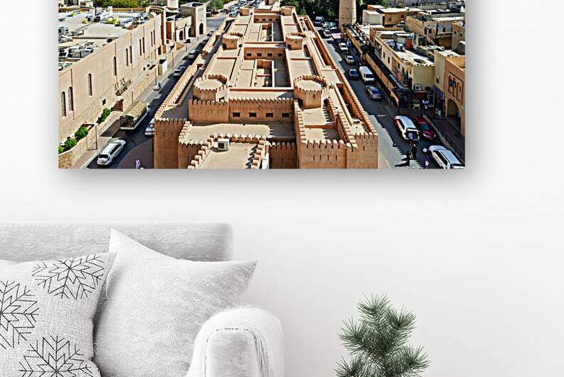 Cityscape view of Nizwa Oman with mountains and buildings by Marco Brivio