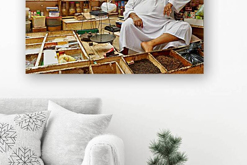 Elderly shopkeeper in his store in Muscat Oman during the day by Marco Brivio