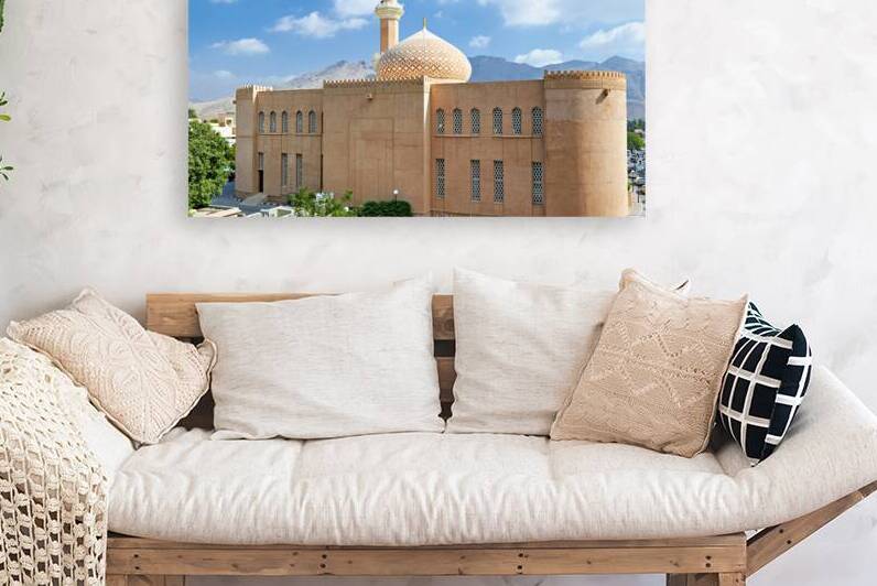 Nizwa Fort view with mountains and clouds in Oman by Marco Brivio