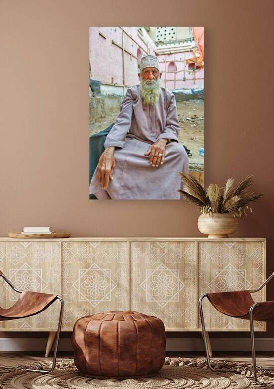 Old man sitting in a historical site in Muscat Oman by Marco Brivio