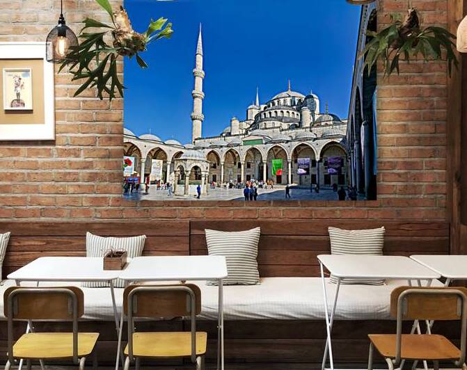 People walk around the Blue Mosque in Istanbul Turkey by Marco Brivio
