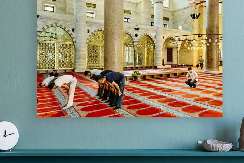 Visitors pray inside Suleymaniye Mosque in Istanbul Turkey by Marco Brivio