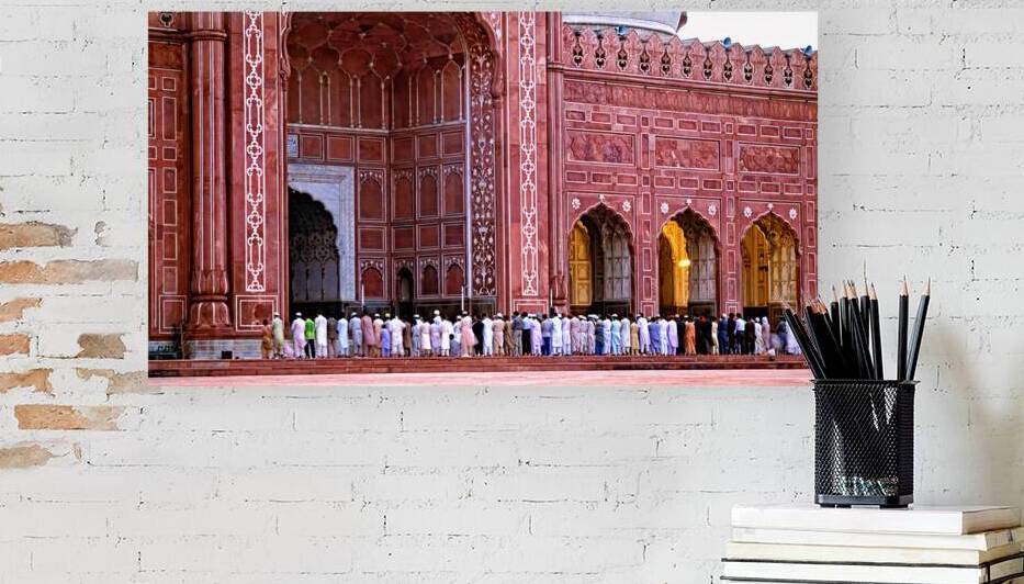 Prayers at Badshahi Mosque during prayer time in Lahore by Marco Brivio